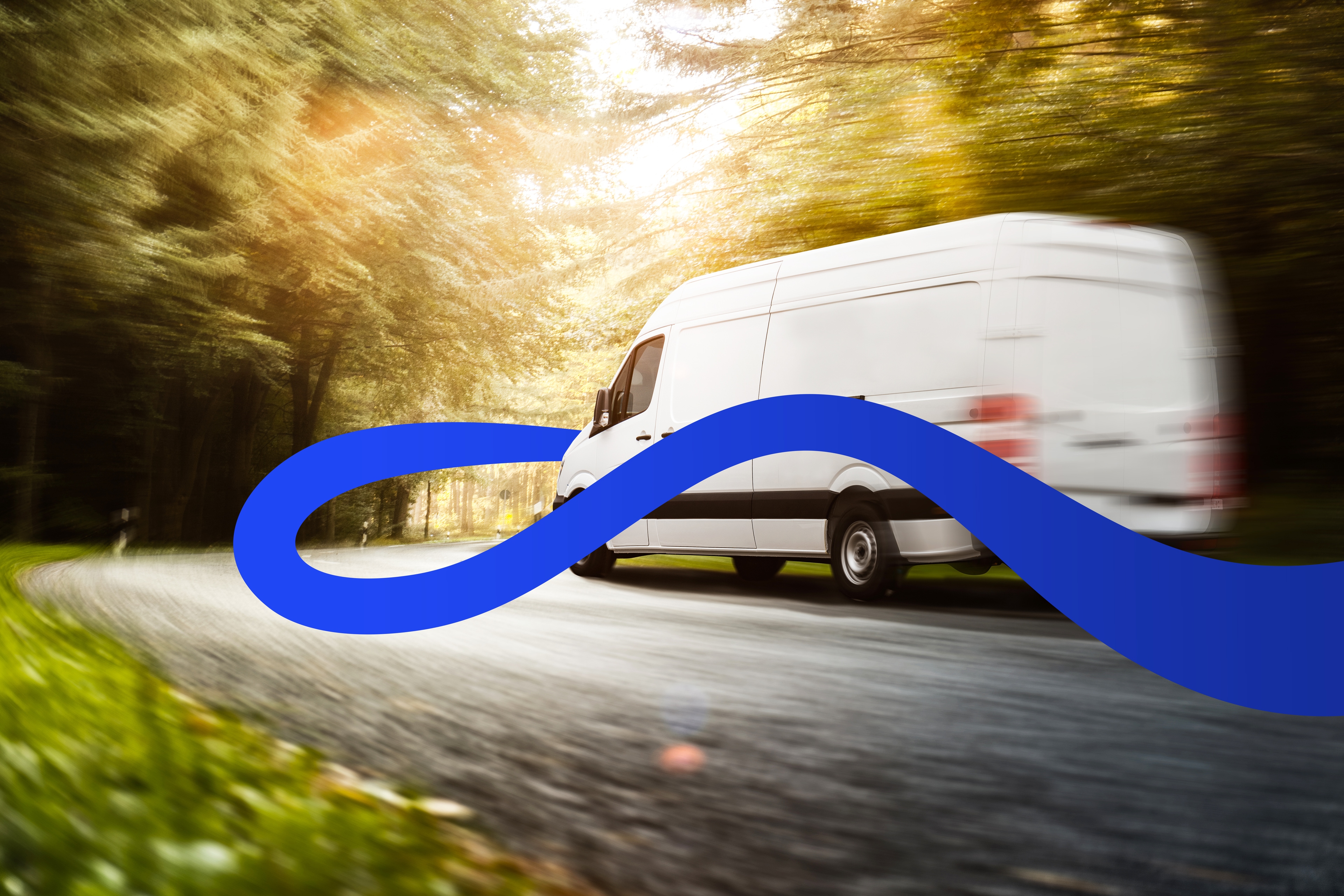 A van drives down a suburban road